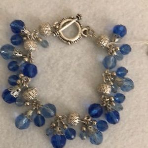 This lovely bracelet has blue stones and silver accents. NWT